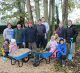 A group volunteers stand in the Centenary Garden at Boultham Park.